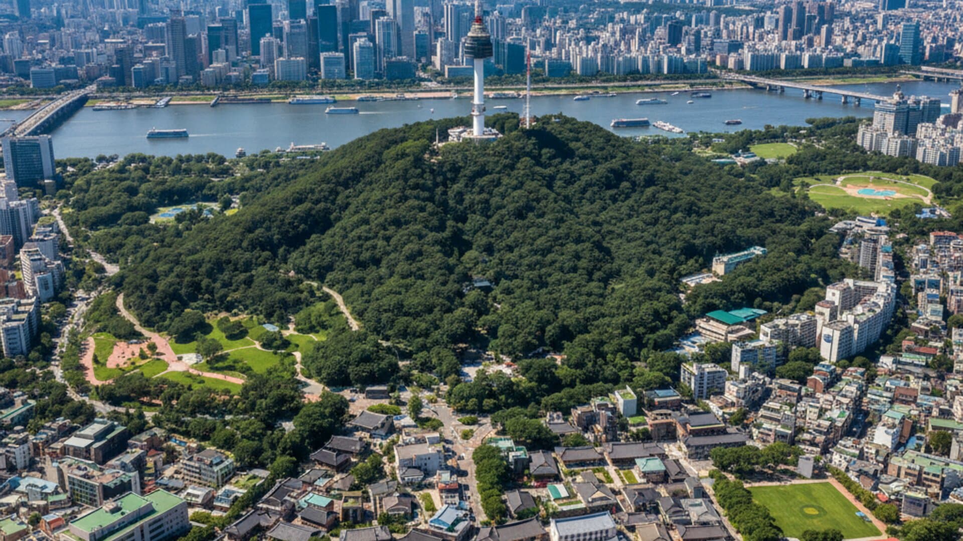 Seoul in bright daylight with modern skyscrapers and Han River