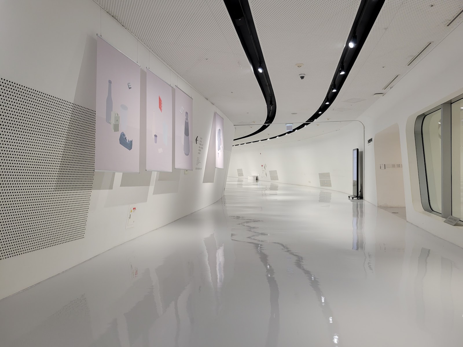 DDP interior gallery — the reflective white floors and curved Hadid geometry