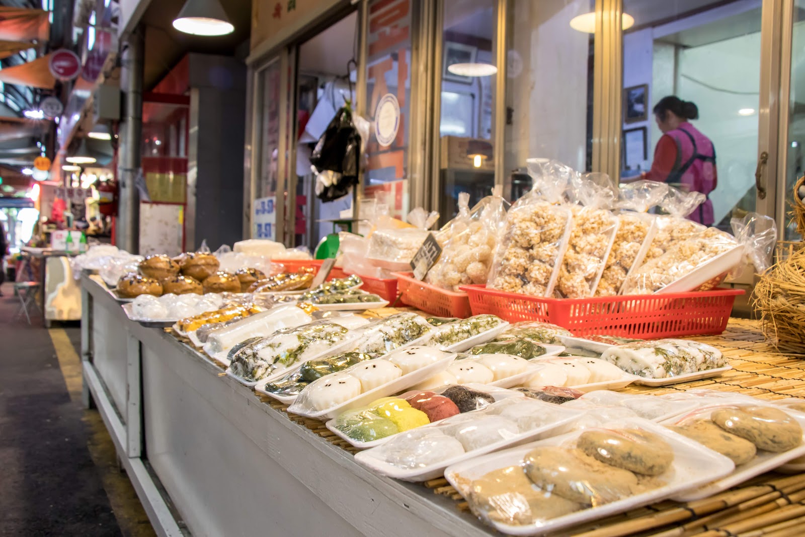 Colorful tteok stall at Tongin Market - traditional rice cakes in vibrant seasonal colors