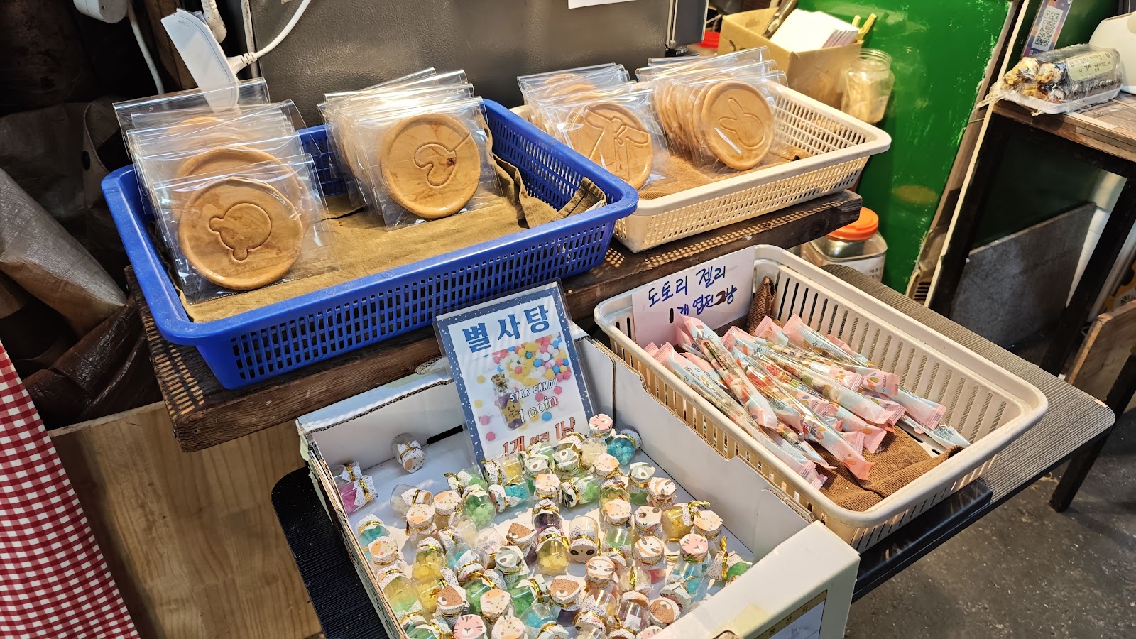 Traditional sweets and snacks at Tongin Market - star candy, acorn jelly, and stamped cookies