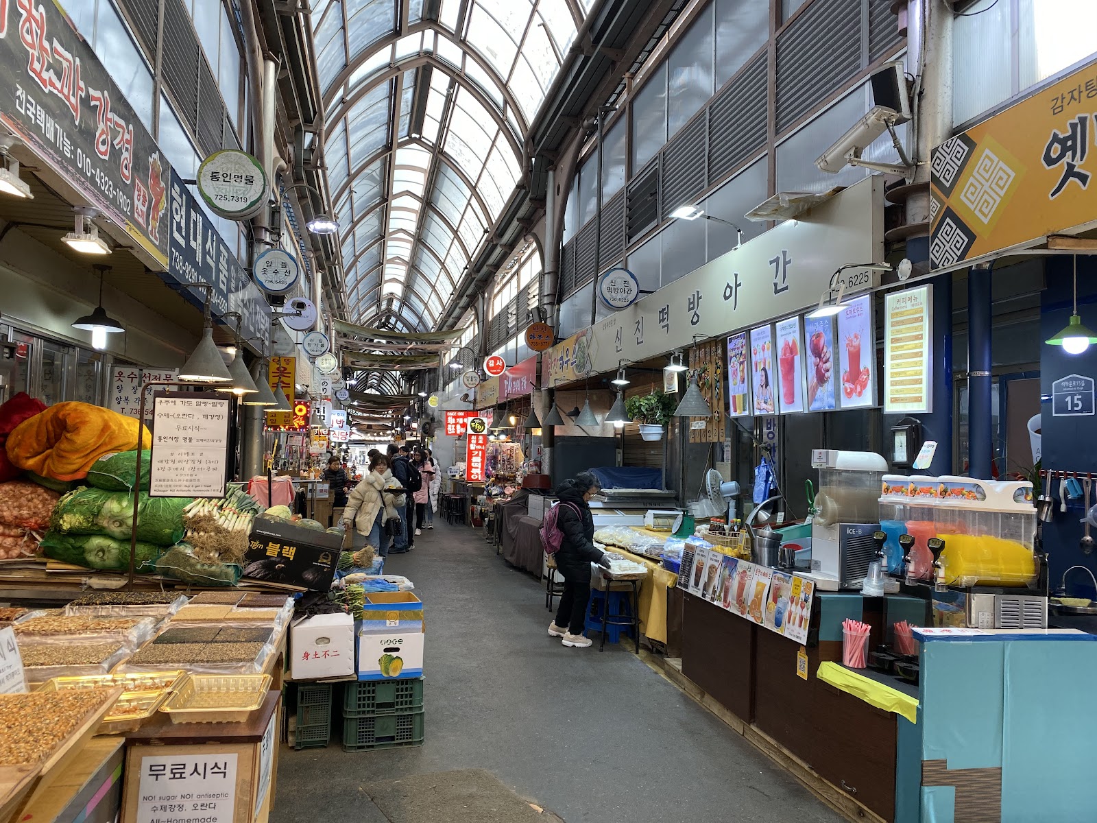 Tongin Market indoor alley - food stalls line both sides of this atmospheric covered market